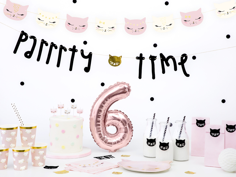 Pink and white cat themed birthday party with balloons and table decorations